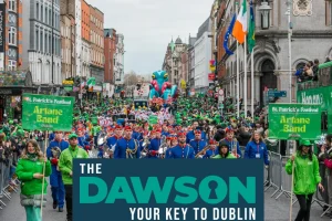 The Dawson Hostel St Patrick’s Day accommodation Dublin 2026 parade crowds and marching band in Dublin city centre on festival day